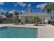 Community pool area with an outdoor kitchen and seating at 16914 Myrtle Hill Ln, Parrish, FL 34219