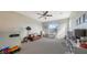 Bright playroom with toys, seating, and large window at 16914 Myrtle Hill Ln, Parrish, FL 34219