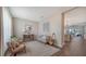 Living room with seating area and view to kitchen at 16914 Myrtle Hill Ln, Parrish, FL 34219