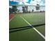 Well-maintained tennis court with a net and green surface at 5941 Gulf Of Mexico Dr, Longboat Key, FL 34228