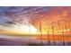 Stunning sunset over the ocean with beach grass in the foreground at 5941 Gulf Of Mexico Dr, Longboat Key, FL 34228