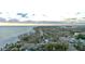Aerial view showcasing a coastal neighborhood with beachfront homes and lush landscaping at 5941 Gulf Of Mexico Dr, Longboat Key, FL 34228