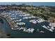 Aerial view of a full marina with many boats docked at 5941 Gulf Of Mexico Dr, Longboat Key, FL 34228