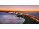 Scenic bridge illuminated at dusk, with palm trees and water views at 5941 Gulf Of Mexico Dr, Longboat Key, FL 34228