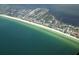 Aerial view of a beachfront community, showing homes and coastal landscape at 5941 Gulf Of Mexico Dr, Longboat Key, FL 34228