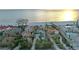 Aerial view of beachfront homes, showcasing oceanfront properties and ongoing construction at 5941 Gulf Of Mexico Dr, Longboat Key, FL 34228