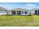 Well maintained backyard with a patio, green grass, and tidy landscaping at 10442 Morning Mist, Sarasota, FL 34241