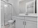 Clean bathroom featuring a toilet, vanity, and glass shower at 10442 Morning Mist, Sarasota, FL 34241