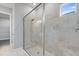 Modern bathroom with a glass enclosed shower and tiled walls at 10442 Morning Mist, Sarasota, FL 34241