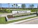 Elegant 'Esplanade at Skye Ranch' entrance sign surrounded by landscaping and decorative brick at 10442 Morning Mist, Sarasota, FL 34241