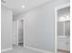 Neutral hallway leading into a bathroom and closet at 10442 Morning Mist, Sarasota, FL 34241