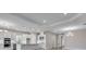 Spacious kitchen with white cabinets, stainless steel appliances, and large island at 10442 Morning Mist, Sarasota, FL 34241