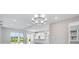 Bright and airy living room with large glass doors offering a view of the outdoor space at 10442 Morning Mist, Sarasota, FL 34241
