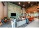 Stylish lounge area with modern furnishings, a large television, and a relaxed atmosphere for social gatherings at 10442 Morning Mist, Sarasota, FL 34241
