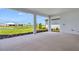 Spacious patio with views of the lake and backyard landscaping at 10442 Morning Mist, Sarasota, FL 34241