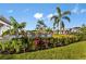 Resort style pool area with lush landscaping, lounge chairs, and palm trees for relaxing days at 10442 Morning Mist, Sarasota, FL 34241