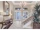 Bright foyer with a staircase, tile floor and large mirror at 1259 Tyne Ln, Bradenton, FL 34208