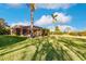 Spacious backyard with a large screened enclosure and lush green grass at 22575 Morning Glory Cir, Bradenton, FL 34202