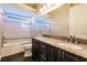 Bathroom boasts dual sinks, granite countertop, and a shower/tub combo at 22575 Morning Glory Cir, Bradenton, FL 34202
