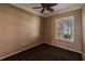 Spacious bedroom with carpeted floor and window with plantation shutters at 22575 Morning Glory Cir, Bradenton, FL 34202