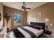 Virtually staged bedroom with a king-size bed and large window at 22575 Morning Glory Cir, Bradenton, FL 34202
