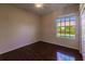 Bright bedroom with hardwood floors and a large window at 22575 Morning Glory Cir, Bradenton, FL 34202
