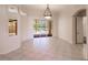 Bright dining room with tile floors and sliding glass doors leading to the pool area at 22575 Morning Glory Cir, Bradenton, FL 34202