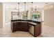 Open kitchen with large island, stainless steel appliances, and views to Gathering room at 22575 Morning Glory Cir, Bradenton, FL 34202