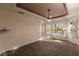 Main bedroom with carpeted floor and large windows at 22575 Morning Glory Cir, Bradenton, FL 34202