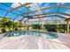 Relaxing screened pool and spa with lush landscaping at 22575 Morning Glory Cir, Bradenton, FL 34202