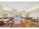 Spacious community room with hardwood floors, elegant lighting, and ample seating for social gatherings and events at 2921 Seasons Blvd, Sarasota, FL 34240