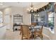 Cozy breakfast nook features a round glass table and chandelier at 2921 Seasons Blvd, Sarasota, FL 34240