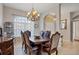 Formal dining room with a chandelier and a dark wood dining set at 2921 Seasons Blvd, Sarasota, FL 34240