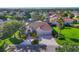 Inviting home with a manicured lawn and a paver driveway leading to a two-car garage at 2921 Seasons Blvd, Sarasota, FL 34240