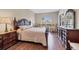 Spacious main bedroom with hardwood floors, large windows, and stylish furnishings creating a tranquil retreat at 2921 Seasons Blvd, Sarasota, FL 34240