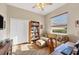 This office features a chair, desk, ceiling fan and a window for ample lighting at 2921 Seasons Blvd, Sarasota, FL 34240