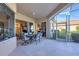 Covered patio featuring outdoor seating and sliding glass doors leading inside at 2921 Seasons Blvd, Sarasota, FL 34240