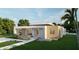 Modern single-story home with clean lines and attractive landscaping at 4014 Bay Shore Rd, Sarasota, FL 34234