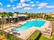 Community swimming pool with people enjoying water aerobics on a sunny day at 5130 Tidewater Preserve Blvd, Bradenton, FL 34208