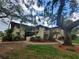 Spanish style condo building with lush landscaping and walkway at 6466 Seagull Dr # 323, Bradenton, FL 34210