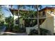 Condo building exterior with two-story design and tropical landscaping at 6466 Seagull Dr # 323, Bradenton, FL 34210