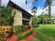 Condo building exterior with landscaping and walkway at 6466 Seagull Dr # 323, Bradenton, FL 34210