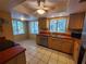 Bright kitchen featuring wood cabinets, tiled floors and modern appliances at 6466 Seagull Dr # 323, Bradenton, FL 34210