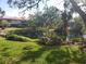 Serene pond view with lush greenery and manicured landscaping at 6466 Seagull Dr # 323, Bradenton, FL 34210