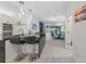 Modern kitchen with island, breakfast bar, and stainless steel appliances at 6741 Rookery Lake Dr, Bradenton, FL 34212