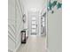 Hallway with modern decorations and front door at 6741 Rookery Lake Dr, Bradenton, FL 34212