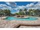 Resort-style pool with lounge chairs and landscaping at 6741 Rookery Lake Dr, Bradenton, FL 34212
