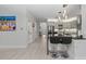 Open concept kitchen and hallway with light wood floors at 6741 Rookery Lake Dr, Bradenton, FL 34212