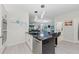Modern kitchen with a large island, stainless steel appliances, and an open layout to the living area at 6741 Rookery Lake Dr, Bradenton, FL 34212
