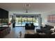 Bright living room with pool view and sliding glass doors for seamless outdoor living at 6741 Rookery Lake Dr, Bradenton, FL 34212